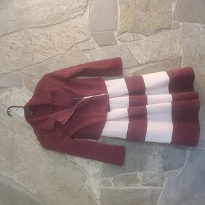 A white and maroon dress with a jacket